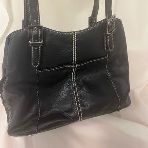Tignanello black purse. Three large pockets, two small outside pockets.